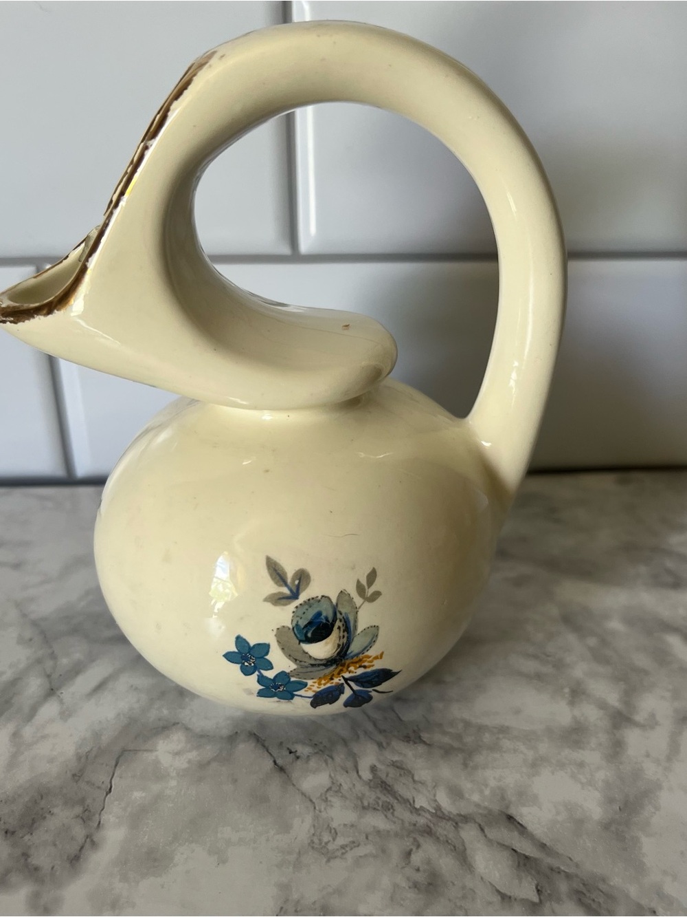 Cream Ceramic Pitcher with Blue Floral Motif